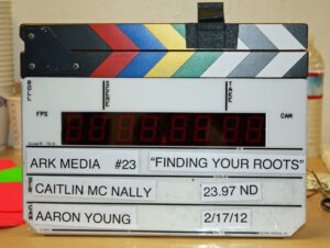 FindingRootsSlapRoll A photo of a clapboard that is with the Finding Your Roots episode.