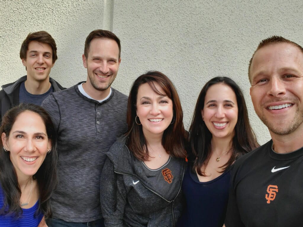 A photo of Shauna with five of her 29 donor siblings.