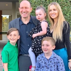 Laura with her husband and three young children.