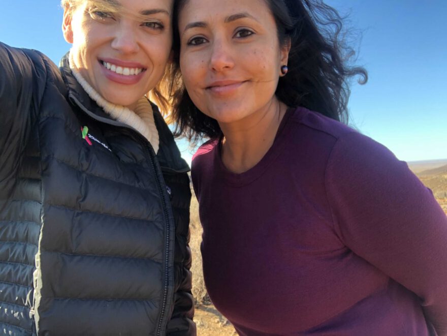 Emily, left, and Anjali, on a recent trip doing local community engagement work for one of 23andMe's Population Collaboration Projects.