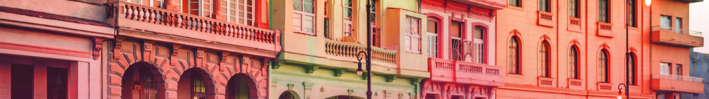 Colorful buildings along a street in the Caribbean.